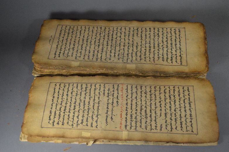 A Mongolian written Buddhist sutra: Buddhist Sutra, china, 19 th c. wrapped in red silk, was written by Mongolian