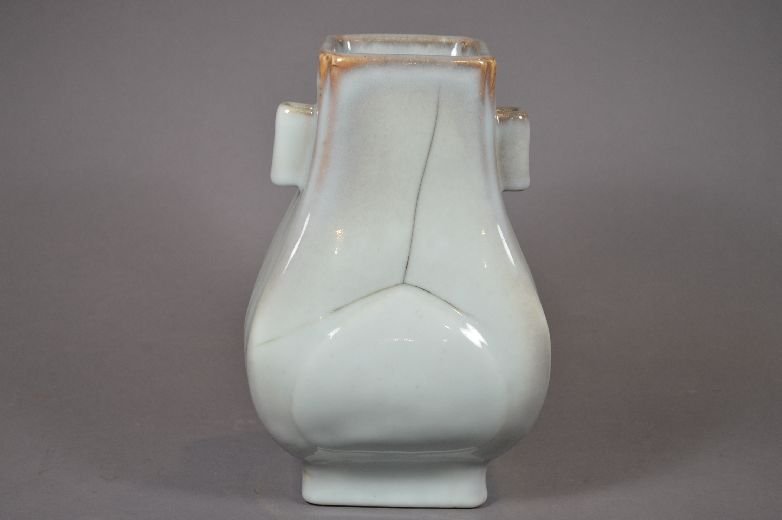 Gray glazed Zun vase: Zun vase, China, in the shape of the archaic drinking vessel zun, flanked by tubular lugs, covered in glaze of gray. hair-line cross the back of body, Qing, Guangxu mark on base.