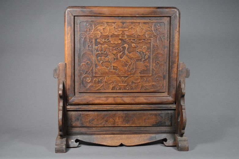 Carved huanghuali wood table screen: table screen, china, carved with crane and flower pattern on screen. With stand. 17" x 16 1/2"