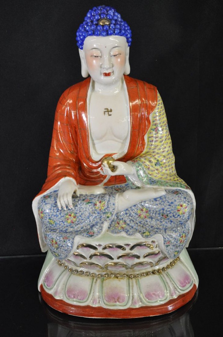 Famille rose statue: Famille rose statue, of a Buddha sitting cross-legged on a lotus flower, left hand holding a bowl, right hand resting on the leg. maker's name carved on the base. 20" x 10"