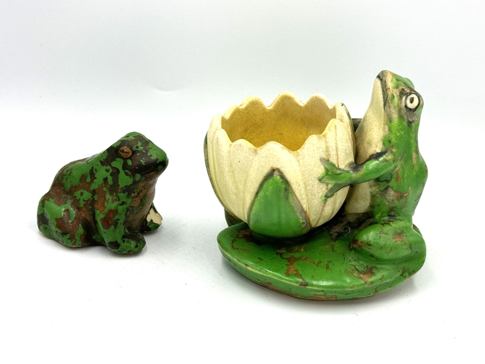 A WELLER COPPERTONE FROG AND LILLY PLANTER AND A CHIPPED COPPERTONE FROG: A WELLER COPPERTONE FROG AND LILLY PLANTER AND A CHIPPED COPPERTONE FROG, 4" x 3" x 4" and 2" x 2.5" x 2.5"