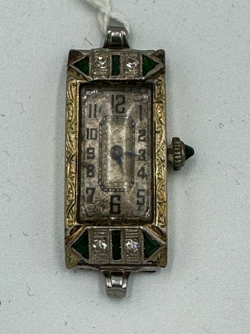 AN 18K WHITE GOLD ART DECO LADIES WATCH W/ DIAMONDS AND EMERALDS, 5.6 GRAMS EXCLUDING WORKS: AN 18K WHITE GOLD ART DECO LADIES WATCH W/ DIAMONDS AND EMERALDS, 5.6 GRAMS EXCLUDING WORKS