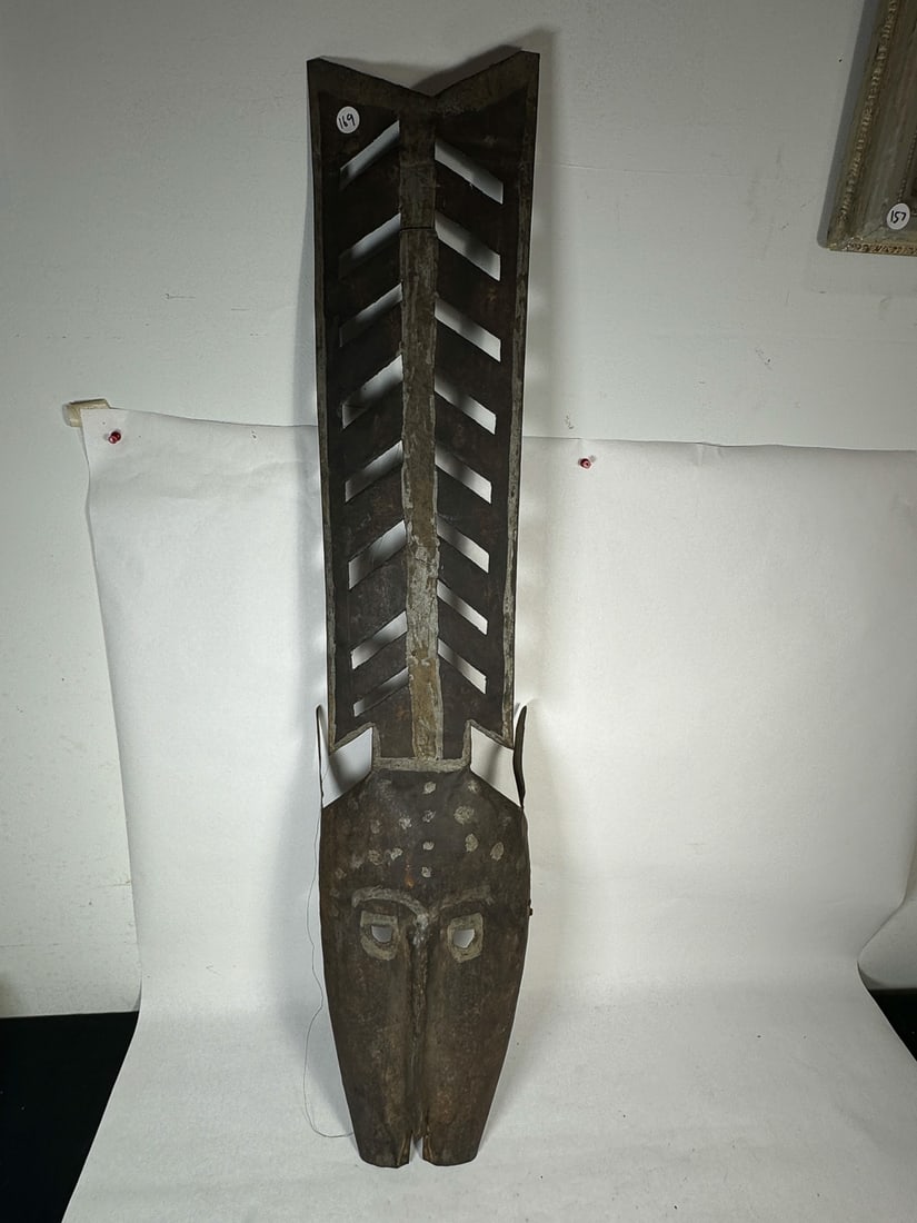 A SHEET METAL TRIBAL MASK: A SHEET METAL TRIBAL MASK