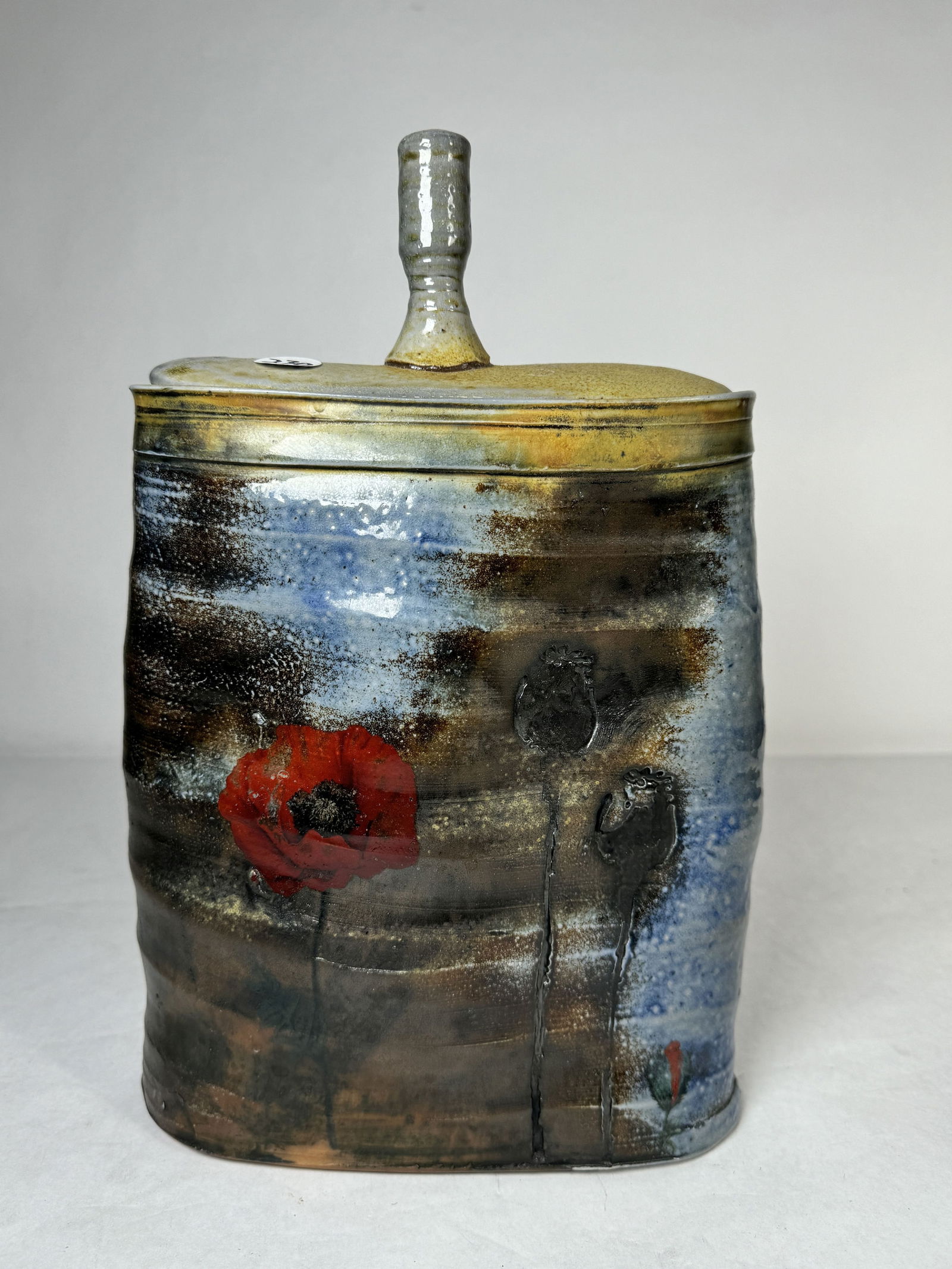 A JUSTIN ROTHSHANK LARGE COVERED JAR 13" T X 8.5" W X 3" D: A JUSTIN ROTHSHANK LARGE COVERED JAR 13" T X 8.5" W X 3" D