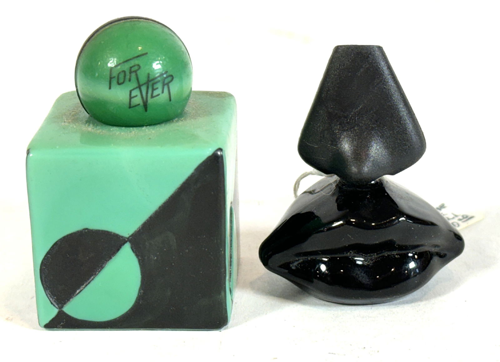 A RARE ART DECO FOREVER PERFUME BOTTLE AND A SALVADOR DALI "LIPS" PERFUME BOTTLE: A RARE ART DECO FOREVER PERFUME BOTTLE AND A SALVADOR DALI "LIPS" PERFUME BOTTLE. 3" TALL AND 2" TALL
