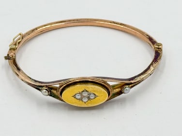 A VICTORIAN 10K GOLD BRACELET W/ SEED PEARLS. 2.5" X 2", FACE IS GOLD, BAND MAY BE LOWER GRADE
