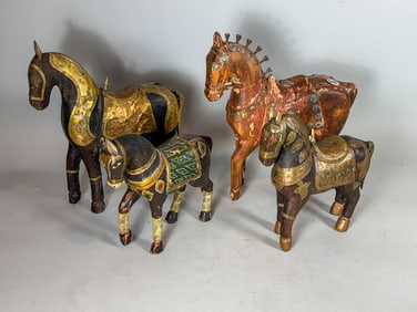 FOUR CARVED WOOD PERSIAN/SOUTHEAST ASIAN HORSES, 10.5" X 11" AND SMALLER