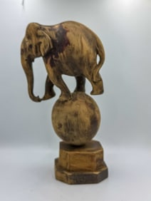 CHINESE CARVED WOODEN ELEPHANT ON GLOBE, 6" X 4" X 12"