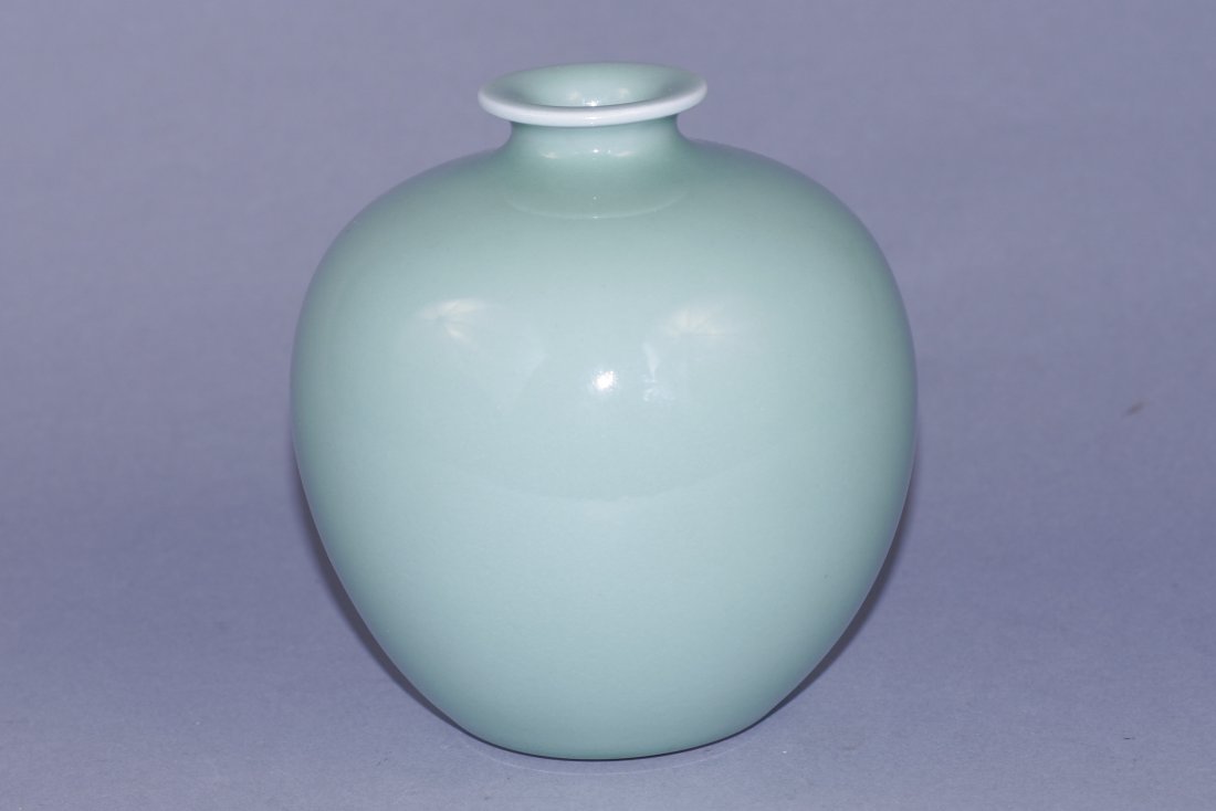 green glazed porcelain jar: green glazed jar, opening mouth, with round shoulder and six character Qianlong mark on base. 6" x 6" x 6"