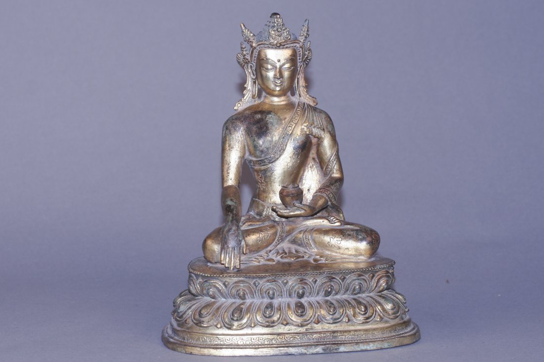 Qing Bronze Figure: Bronze Buddha, china, Qing Dynasty, bronze Buddha sitting cross-legged on a lotus throne, left hand palm up holding a jar , right hand drooping naturally, finger ground, which represents the tradition