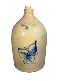 AN OTMAN BLUE DECORATED 3 GALLON STONEWARE JUG, 9" DIAMETER X 17" TALL