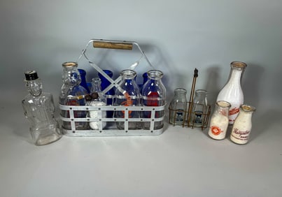 A COLLECTION OF 13 MILK BOTTLES W/ 2 CARRIERS, 10" AND SMALLER