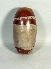 A LARGE SHIVA STONE, 5" DIAMETER X 10" TALL