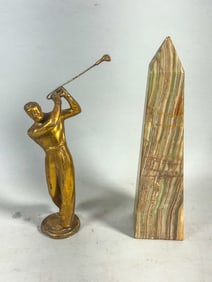 A STONE OBELISK AND A 1920S GOLF STATUE, 10.5" AND 8.5"