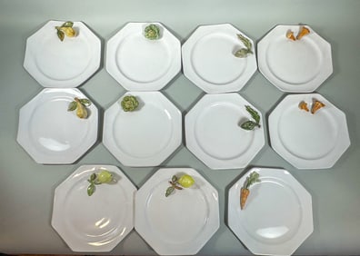 A SET OF 11 SEGRIES VEGETABLE PLATES, 10" DIAMETER