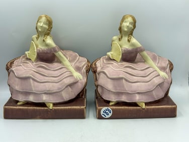 A PAIR OF ROOKWOOD POTTERY SEATED WOMAN BOOKENDS, 7" EACH