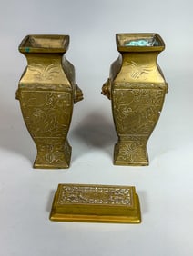 A PAIR OF BRASS VASES AND A BRASS STAMP HOLDER