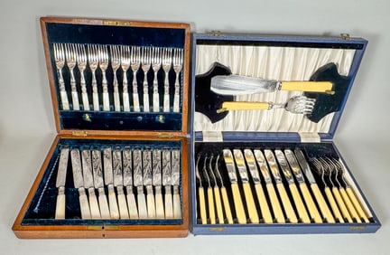 A MOP HAND CHASED CASED KNIFE AND FORK SET