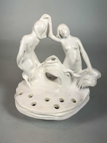 A WELLER POTTERY NUDE SIRENS FLOWER FROG, 7" X 6" X 6"