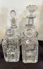 FOUR ANTIQUE CRYSTAL DECANTERS 13.5" AND SMALLER