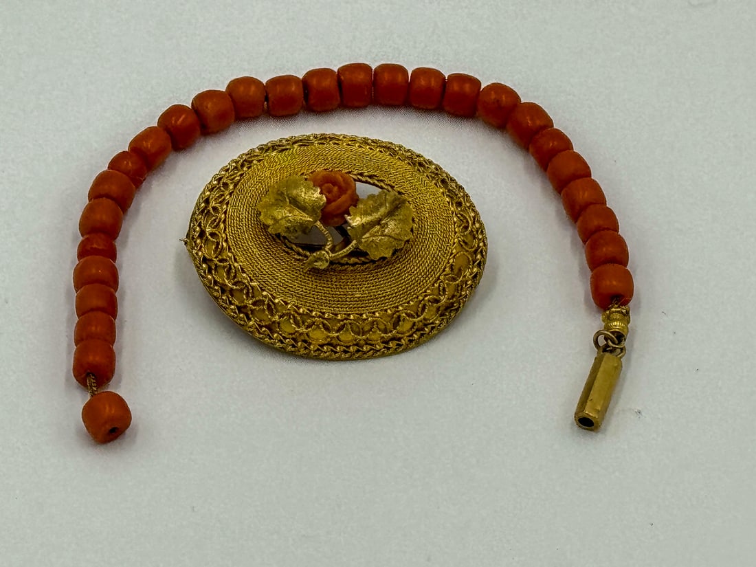 A 14K GOLD AND CORAL PIN W/ CORAL BRACELET, 6.3 GRAMS