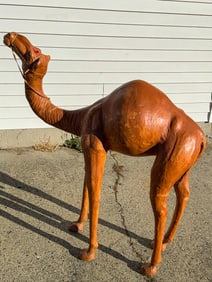 A LEATHER GIRAFFE, 42" X 18" X 48"