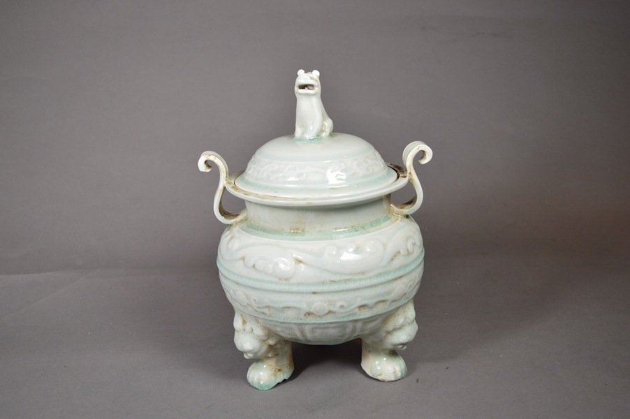 Green Glazed Porcelain Censer: white glazed censer, carved flower pattern on body, and three legs, carved cover with foo-lion. 11" x 7 1/2"