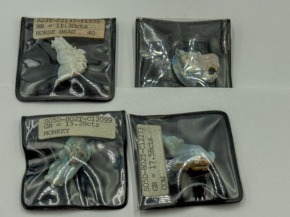 4 CARVED OPAL FIGURAL PENDANTS: 4 CARVED OPAL FIGURAL PENDANTS