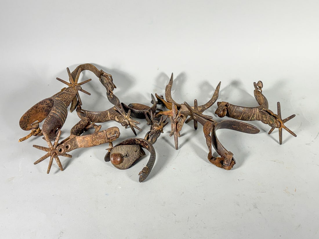 LOT OF ANTIQUE CAST IRON/BLACKSMITHED SPURS, 6" X 5" AND SMALLER: LOT OF ANTIQUE CAST IRON/BLACKSMITHED SPURS, 6" X 5" AND SMALLER
