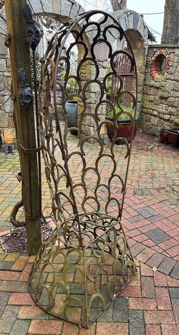 MICHAEL KACERGIS 1944-2023 A PAIR OF WROUGHT IRON HORSESHOE CHAIRS, 30" X 20" X 66" (1 of 4)