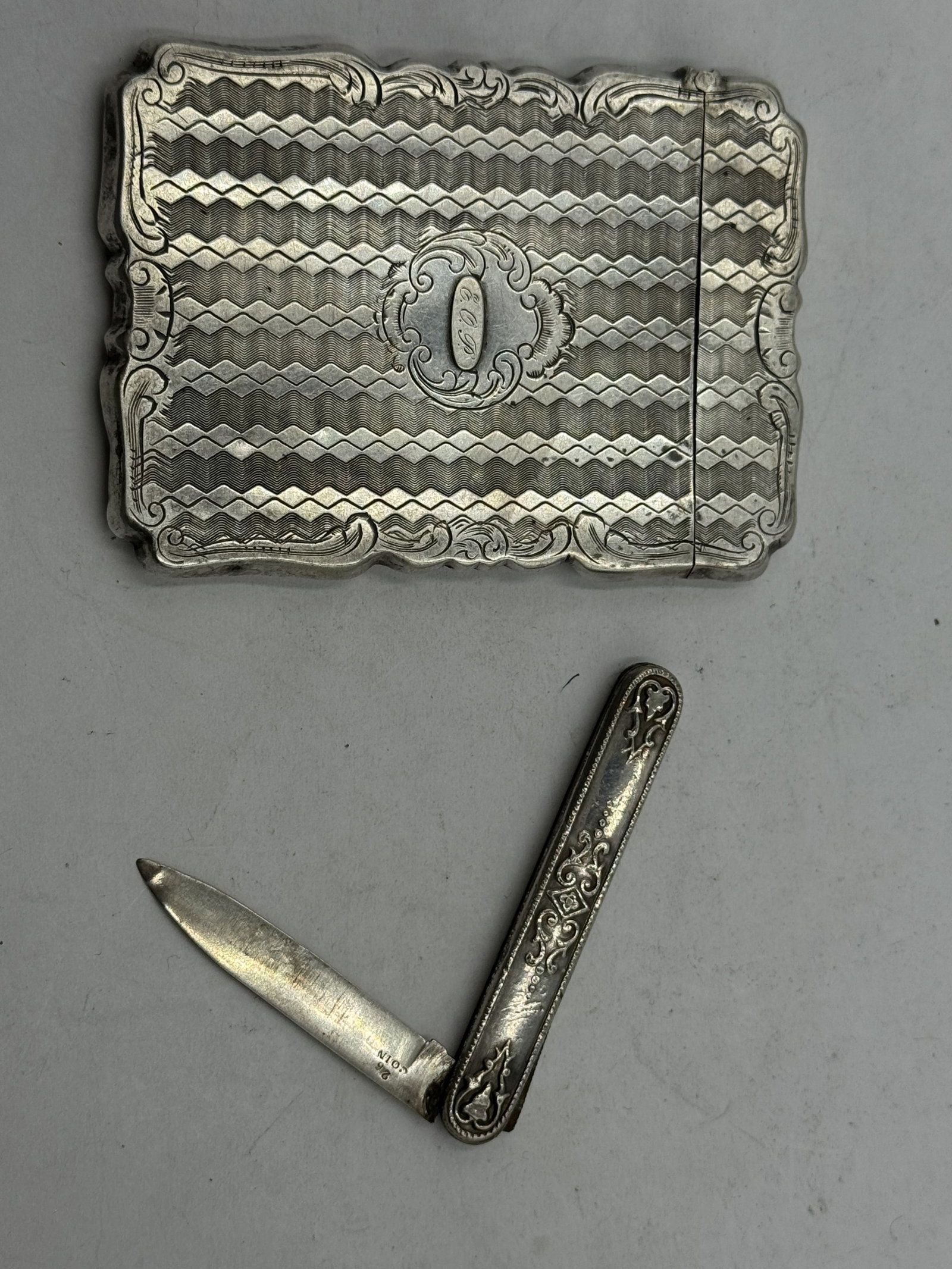 STERLING SILVER HAND CHASED CARD CASE AND FRUIT KNIFE, 19TH C.: STERLING SILVER HAND CHASED CARD CASE AND FRUIT KNIFE, 19TH C.