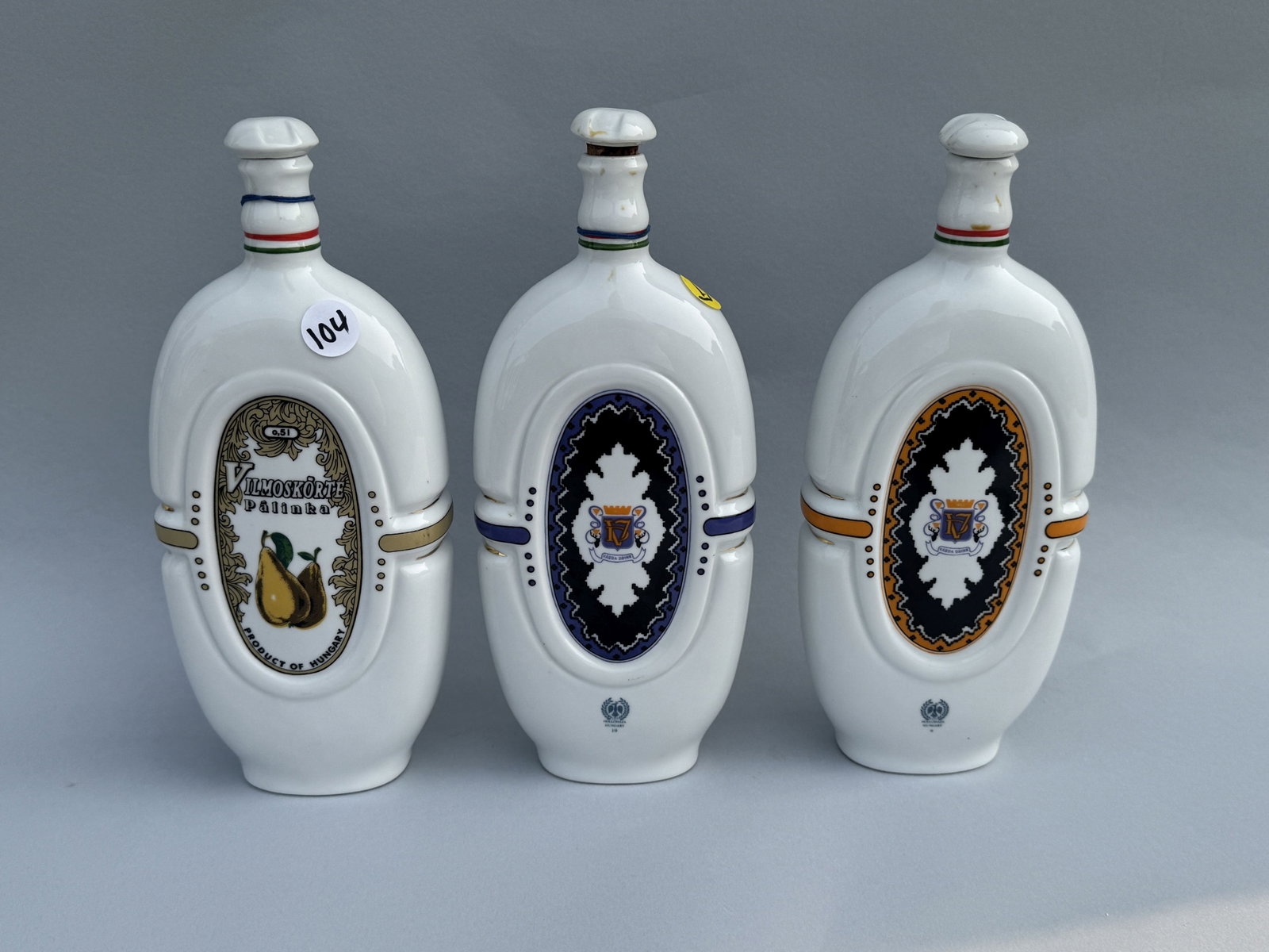 3 HUNGARIAN PORCELAIN LIQOUR BOTTLES, 5" X 10": 3 HUNGARIAN PORCELAIN LIQOUR BOTTLES, 5" X 10"