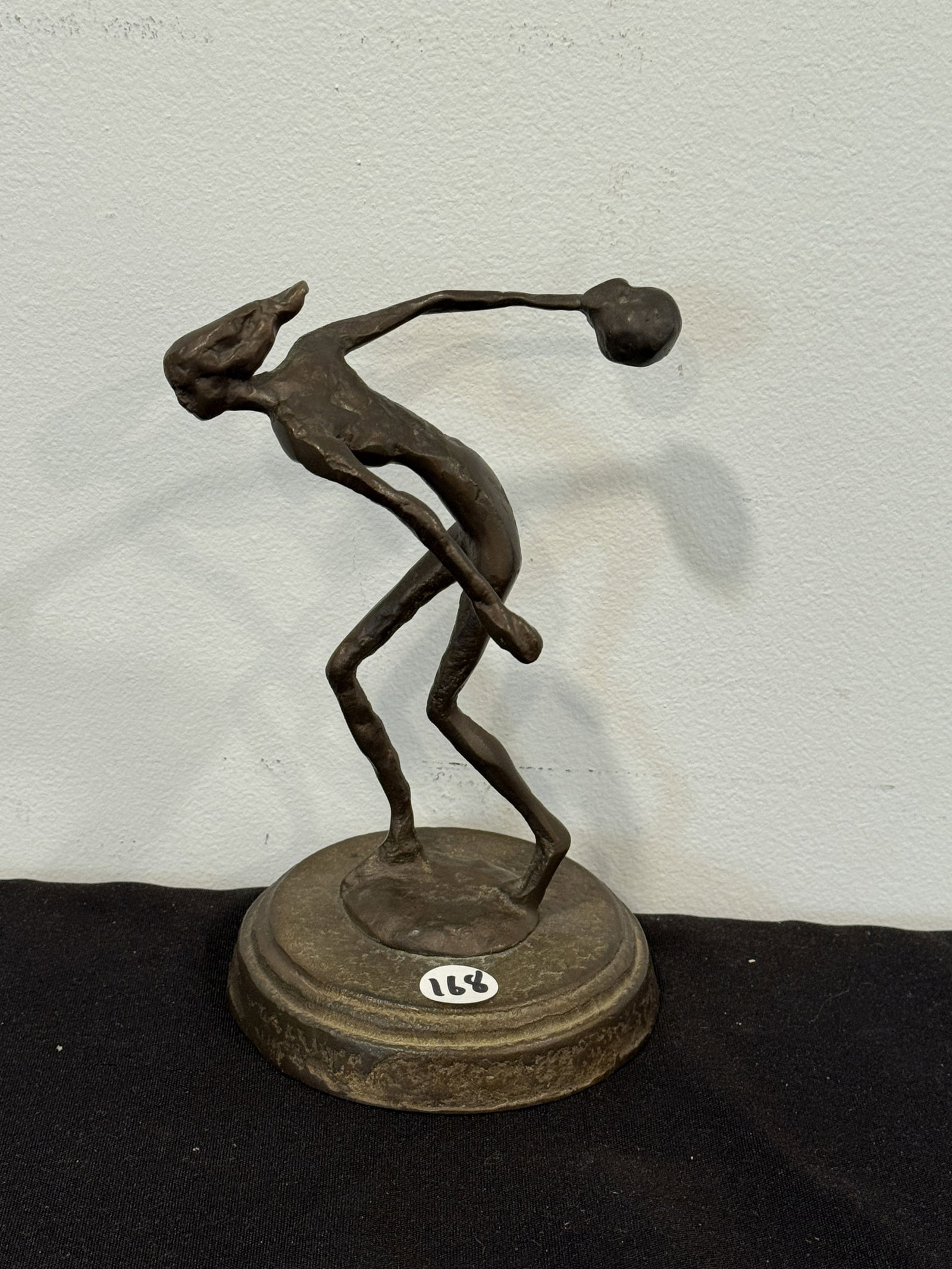 MIDCENTURY BRONZE OF A BOWLER, 7.5" X 4.5" X 2.25": MIDCENTURY BRONZE OF A BOWLER, 7.5" X 4.5" X 2.25"