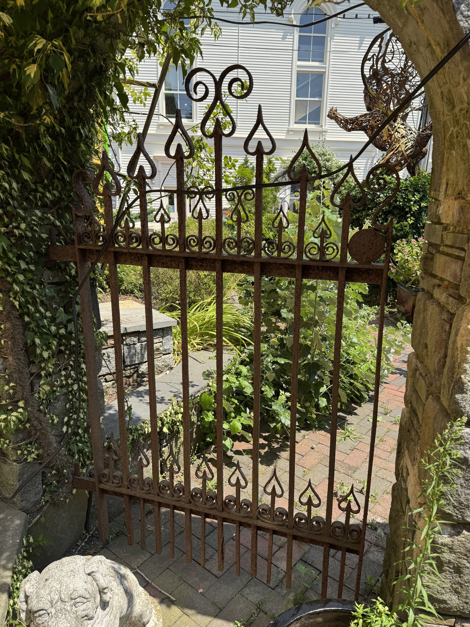 A PAIR OF ANTIQUE CAST IRON GATES: A PAIR OF ANTIQUE CAST IRON GATES. BUYER IS RESPONSIBLE FOR REMOVING THIS ITEM FROM THE PROPERTY.THIS ITEM MUST BE PICKED UP ON OR BEFORE FRIDAY, AUGUST 7TH, 2026 AT 4 CENTER ST IN PROVINCETOWN, MA.