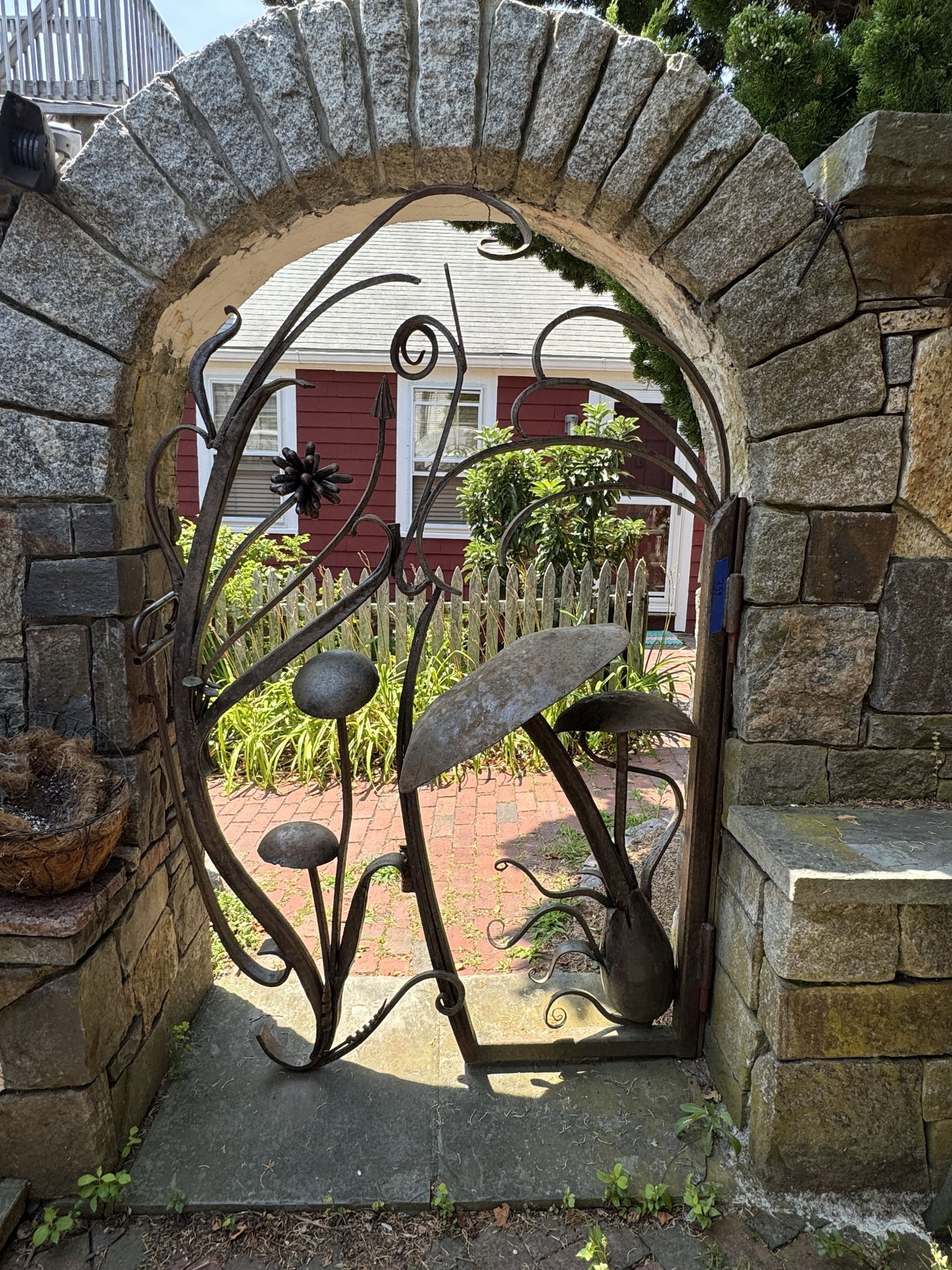 MUSHROOM WROUGHT IRON GARDEN GATE: MUSHROOM WROUGHT IRON GARDEN GATE. BUYER IS RESPONSIBLE FOR REMOVING THIS ITEM FROM THE PROPERTY. THIS ITEM MUST BE PICKED UP ON OR BEFORE FRIDAY, AUGUST 7TH, 2026 AT 4 CENTER ST IN PROVINCETOWN, MA.
