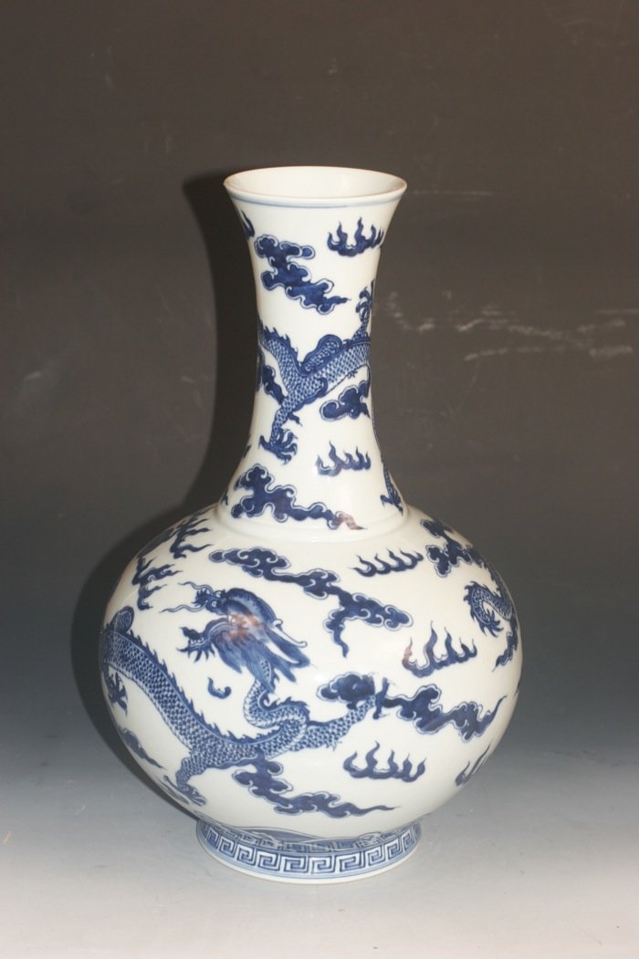 Blue And White Porcelain Bottle Vase: Porcelain bottle vase, china, Qing dynasty, decorated with flying dragon and cloud around body, with six Chinese character Tongzi mark on base. 15''H