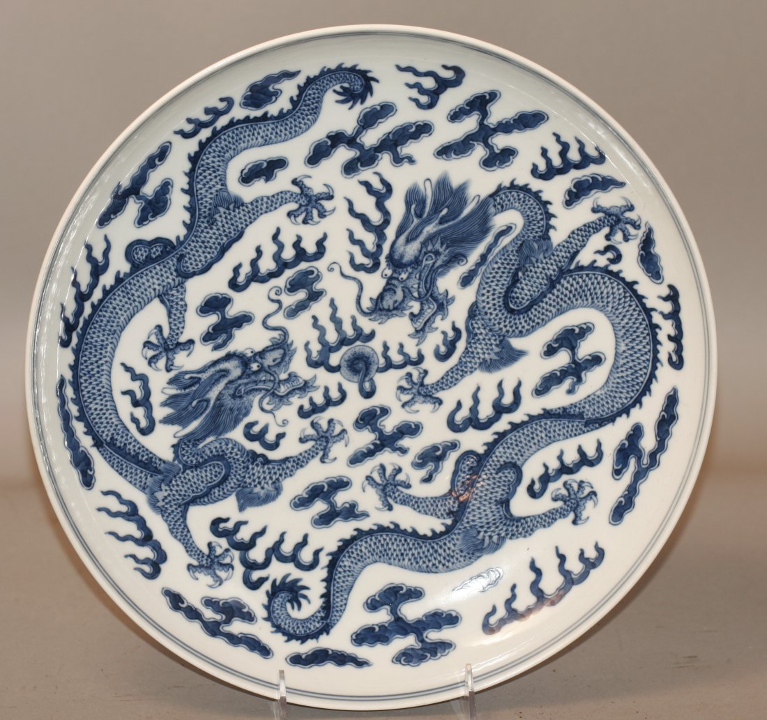 Qing Guangxu Blue And White Porcelain Dragon Plate: Porcelain Dragon plate. 19c. Decorated with fly dragon. And daoguang mark on base. 13" D