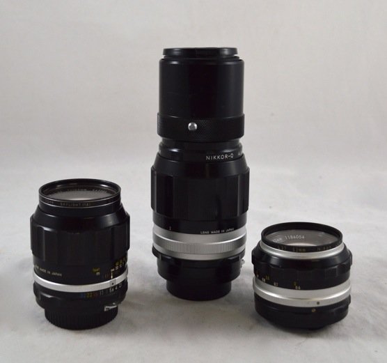 3 Nikon Lenses: 3 Nikon Lenses. 52 mm (serial no. 522484), 50 mm (serial no. 1184054) and 105 mm (serial no. 445889)