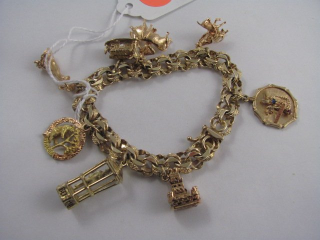 14K Gold Charm Bracelet with 8 Charms: 14K Gold Charm Bracelet with 8 Charms. 52.5 g