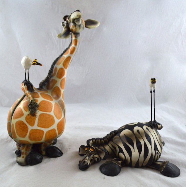 2 Art Pottery Pieces- Giraffe and Zebra, Todd Warner: 2 Art Pottery Sculptures- Giraffe and Zebra. 17'' h and 10 1/2'' high. Artist signed, Todd Warner