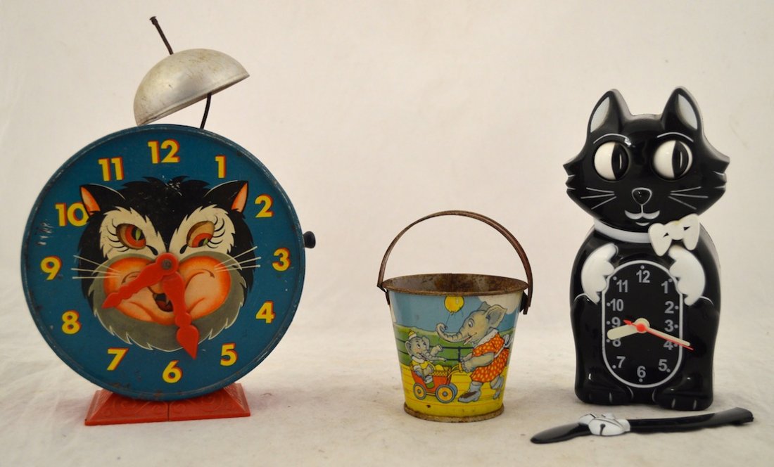 Vintage Toys- Cat Clock, Mattel 1952 Alarm Clock, Pail: Collection of Vintage Toys- a Cat Clock with Swinging Tail, a 1952 Mattel Hickory Dickory Dock Alarm Clock. Stover Candies Miniature Pail. Cat Cock: 9'' ht. Alarm Clock: 10'' ht. Wear consistent with