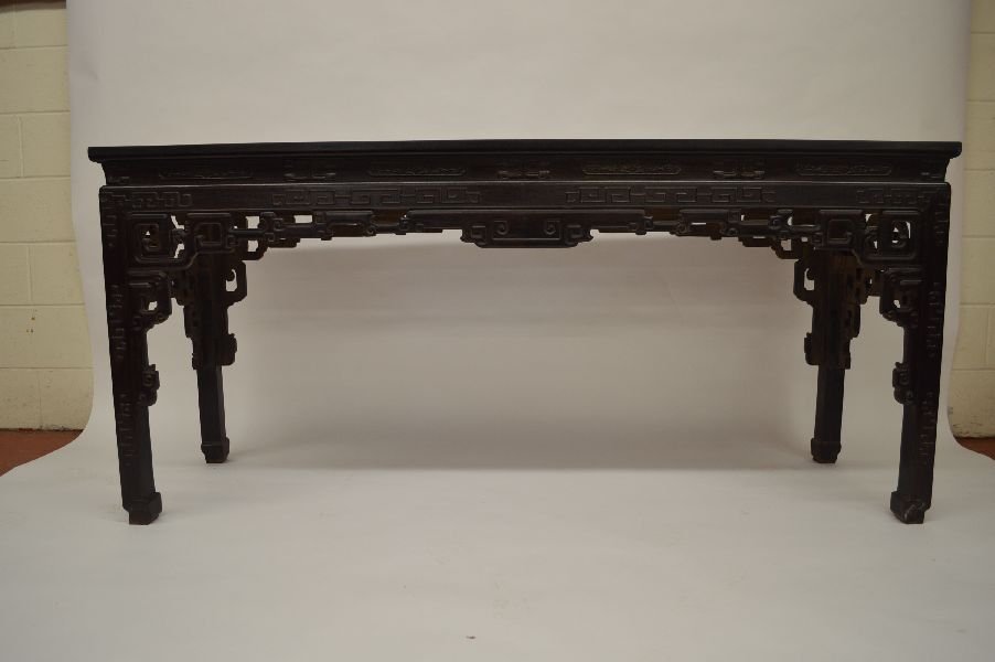 Delicate Carved Zitan Altar Table: Zitan table, China, Qing dynasty, the shoulder and pierced apron with cloud decoration, with diamond-shape underside and scroll feet. 32”H x 71”L x 21”W