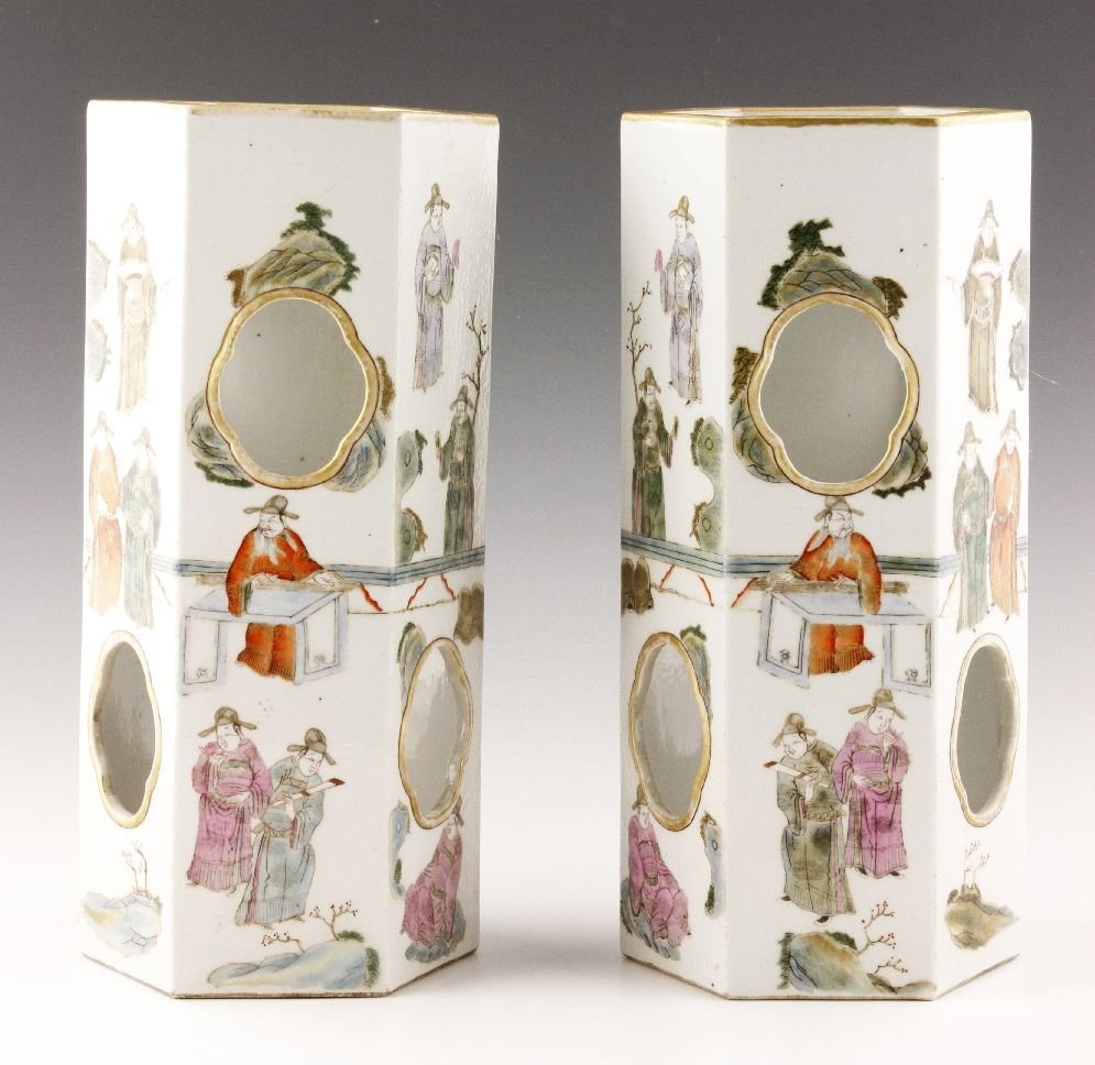 Pr. Famille Rose Hat Stand stand Vases: Pair of famille rose porcelain hat stand vases, China, late Qing Dynasty, each of six sides having a gilt-lined circular opening and decorated with figures of scholars, 11"h.