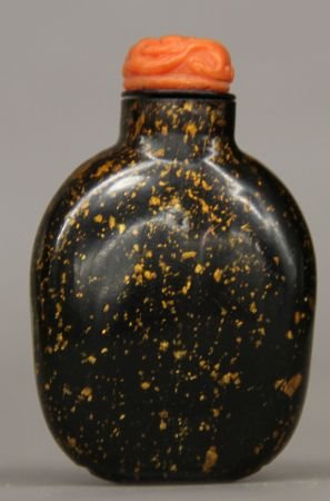 Black Peking Glass Snuff Bottle: Black Peking glass snuff bottle, China, round shape, with brown spots on black ground, a red animal shaped bottle cap. 2 3/4"
