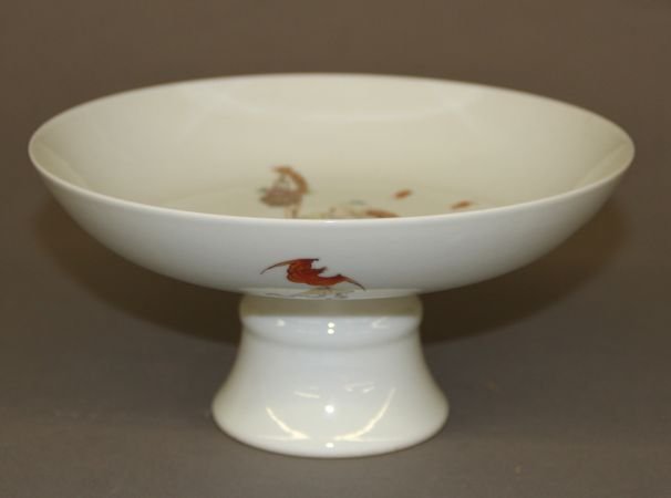 Famille Rose higher base plate: Famille rose higher base plate, China, decorated with an old man and a child near a rock in the center and red bats on the back, blue Yongzheng mark on base. 7" X 3 1/2"