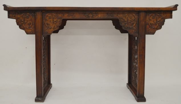 Large Huanghuali Wood Altar Table: Large Huanghuali wood altar table, China, decorated with flying dragons in relief. 60"W X 17" D X 33" T