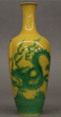 Famille Rose Porcelain Vase: Famille rose porcelain vase, China, decorated with green flying dragons above waves on a yellow ground, mark on base.9 1/4"