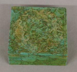 Carved Turquoise Box: Carved turquosie box, China, square shape, decorated with a flower surrounded by incised animals on cover. 1 1/4" X 3 1/2" X 3 1/2"