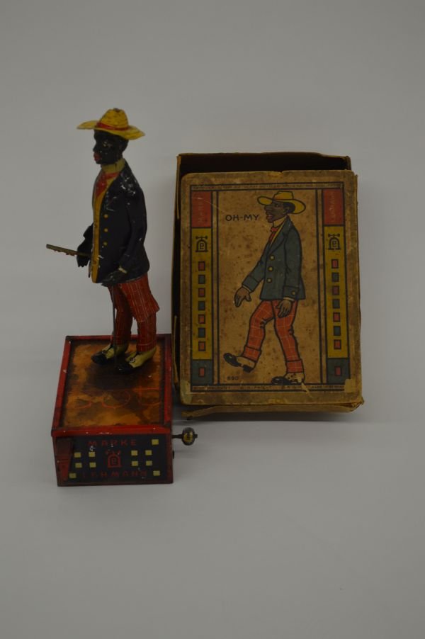 MARKE LEHMAN "OH MY" BLACK AMERICANA TOY: MARKE LEHMAN "OH MY" BLACK AMERICANA TIN LITHOGRAPHED WIND UP TOY WITH BOX.