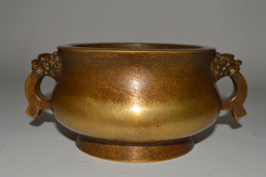 Bronze Censer: Bronze censer, China, republic period, round shaped and dragon shaped holder, carved Ming Xuande mark on base. 3” x 7 3/4”